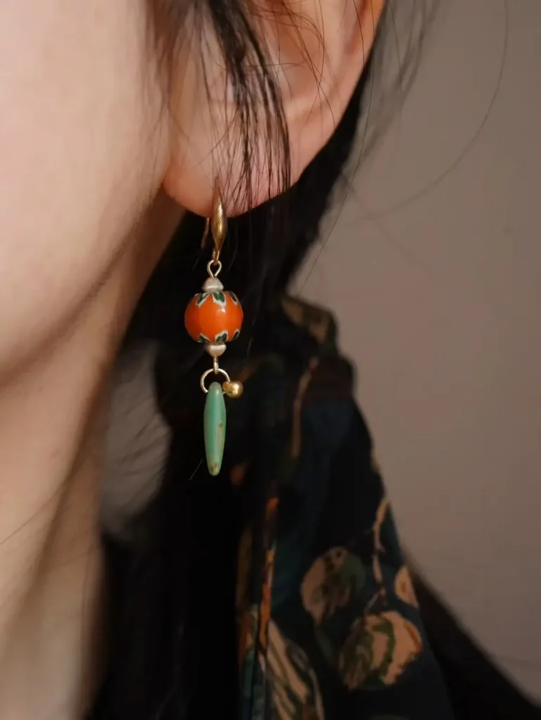 Customer wearing Dunhuang collection handmade vintage earrings with glass beads