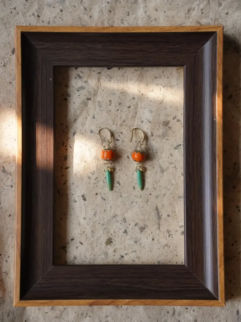Hand-painted orange glass bead vintage earrings add a vibrant retro touch to your everyday style.