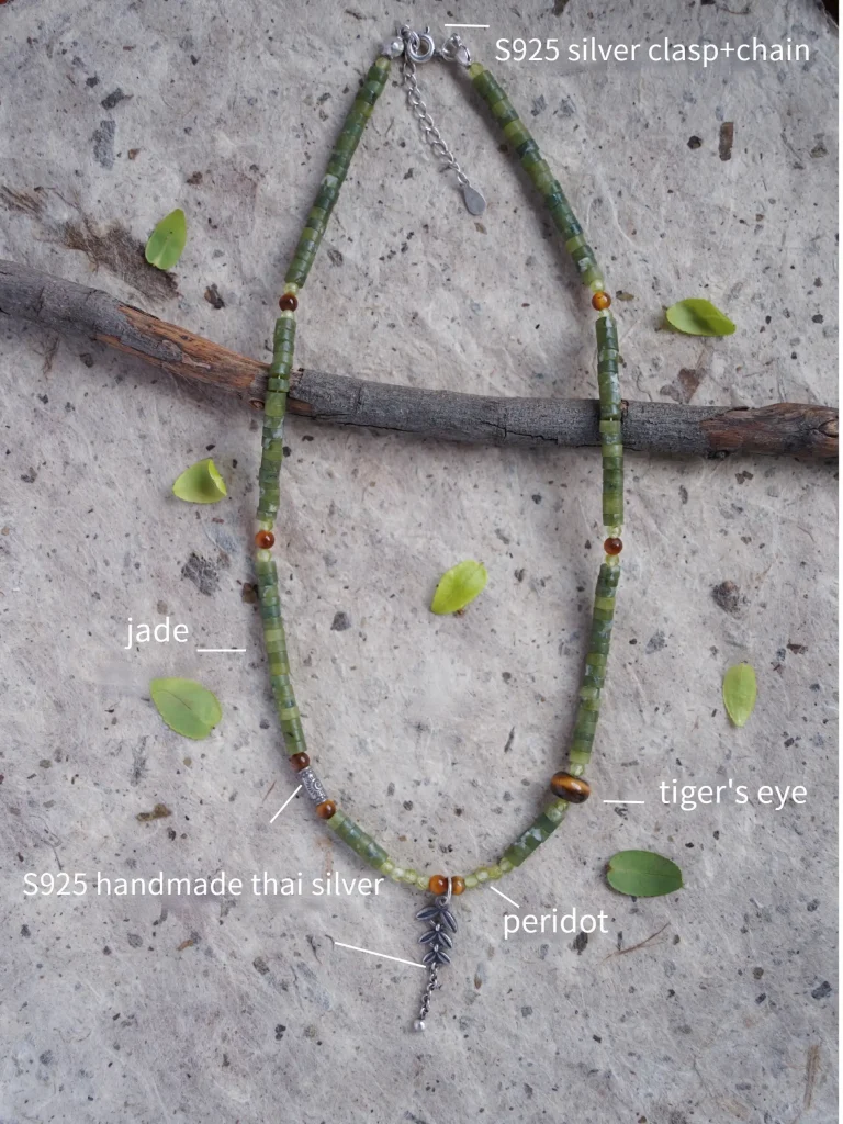 Handcrafted original necklace featuring southern jade, tiger’s eye, peridot, and Thai silver details.