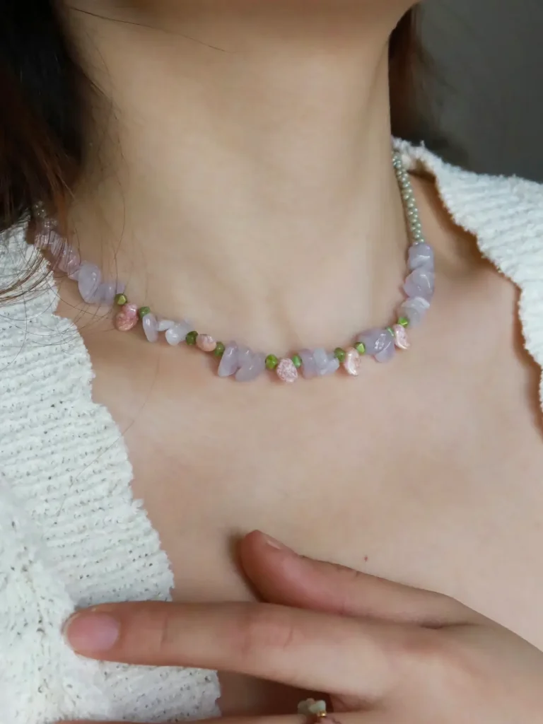 Model wears a handcrafted necklace that highlights its natural beauty and elegant design.