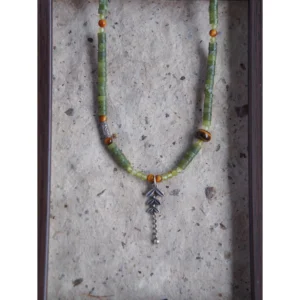 Handmade jade necklace paired with sterling silver accessories, perfect for a vintage-style daily wear.