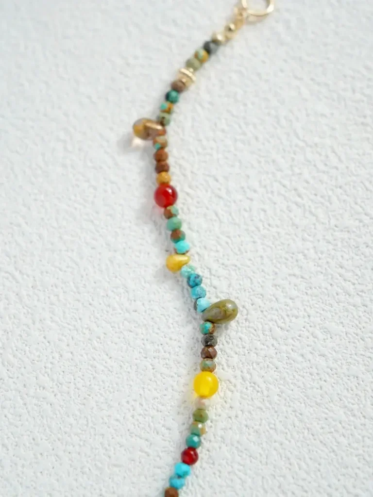 Handmade vintage gemstone bracelet infuses dopamine energy into your holiday look with vibrant colors and bold charm.