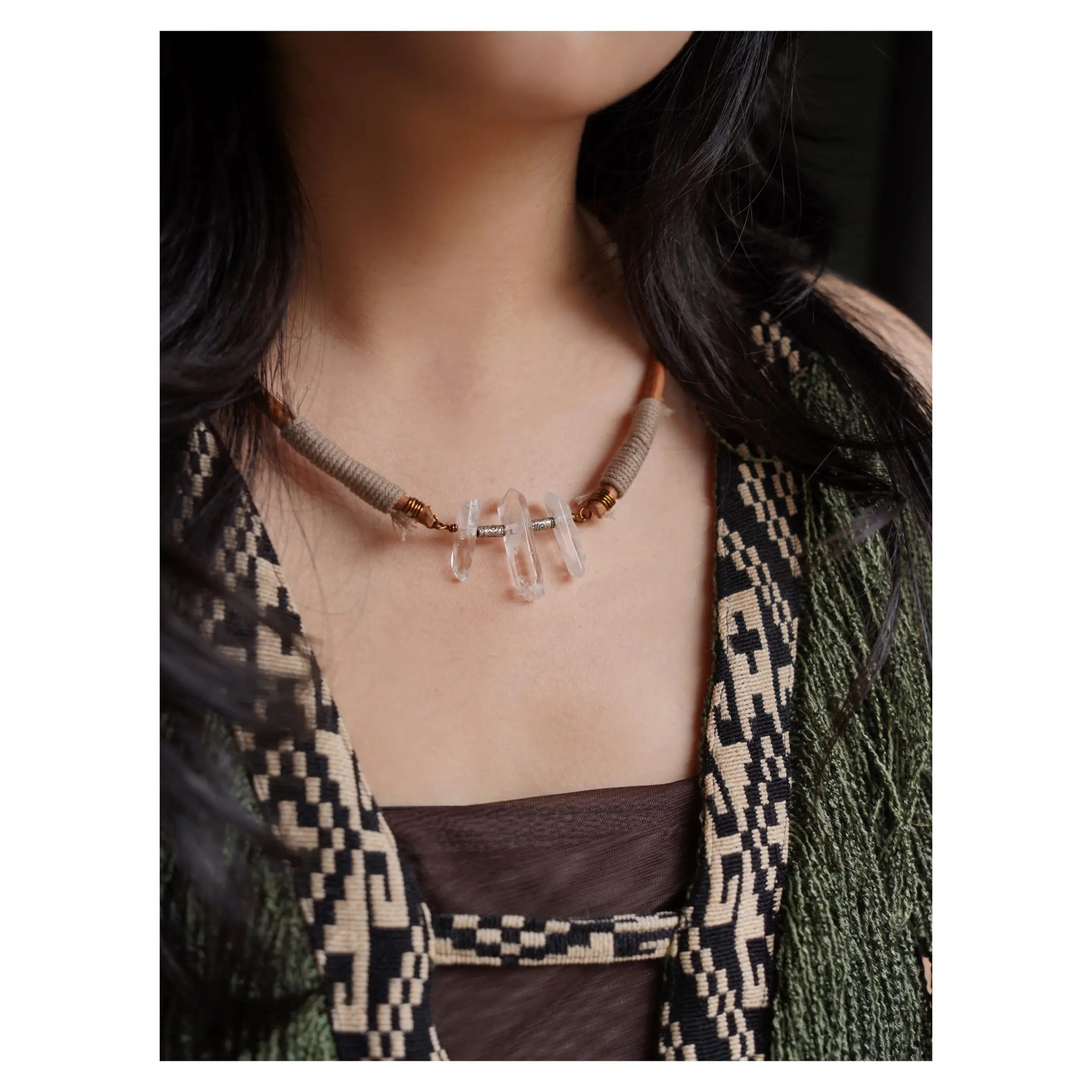 Handmade boho crystal necklace adds rustic elegance as the model channels a natural free-spirited vibe.