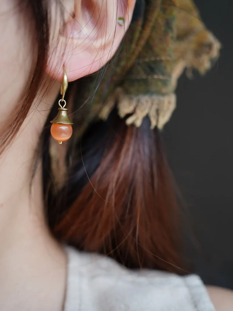 Handmade orange dangle earrings crafted from natural stones, refined jewelry for daily wear