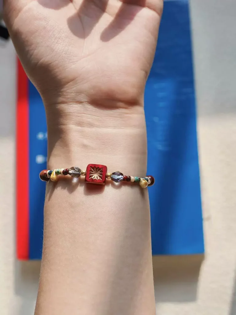 Signature bracelet with vintage Czech beads—handmade fashion accessory for stylish holiday looks