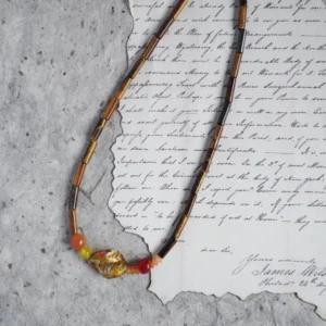 This handmade necklace blends tiger’s eye with agate for a vintage-inspired, earthy elegance.