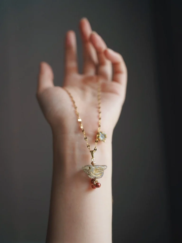 Handmade pendant necklace handcrafted with natural beads, perfect for layering to enhance boho-inspired everyday style.