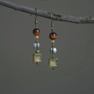 Vintage cottagecore jewelry featuring natural tiger's eye and brass hooks.