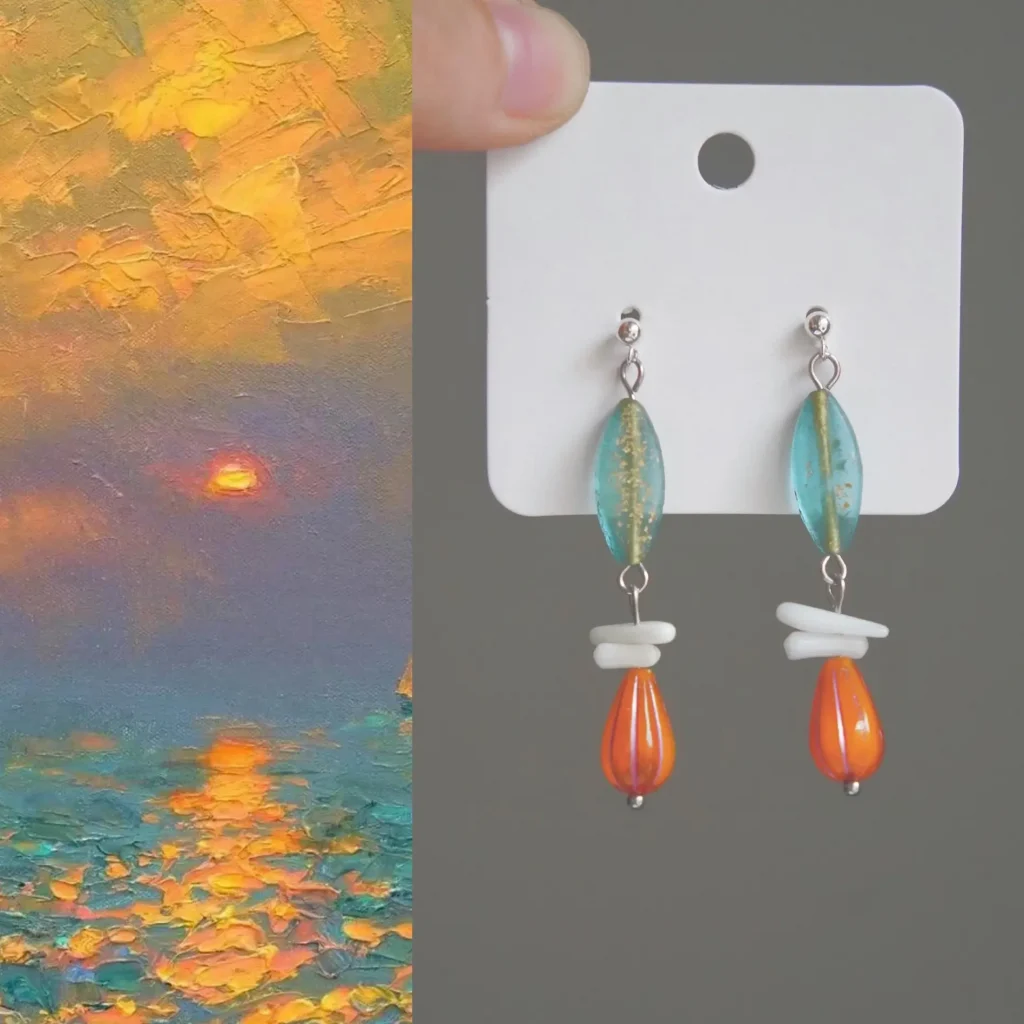 925 sterling silver earrings combine natural white shell fragments with blue and orange Czech glass beads, creating a color palette inspired by coastal landscapes, sunset skies, and ocean waves.
