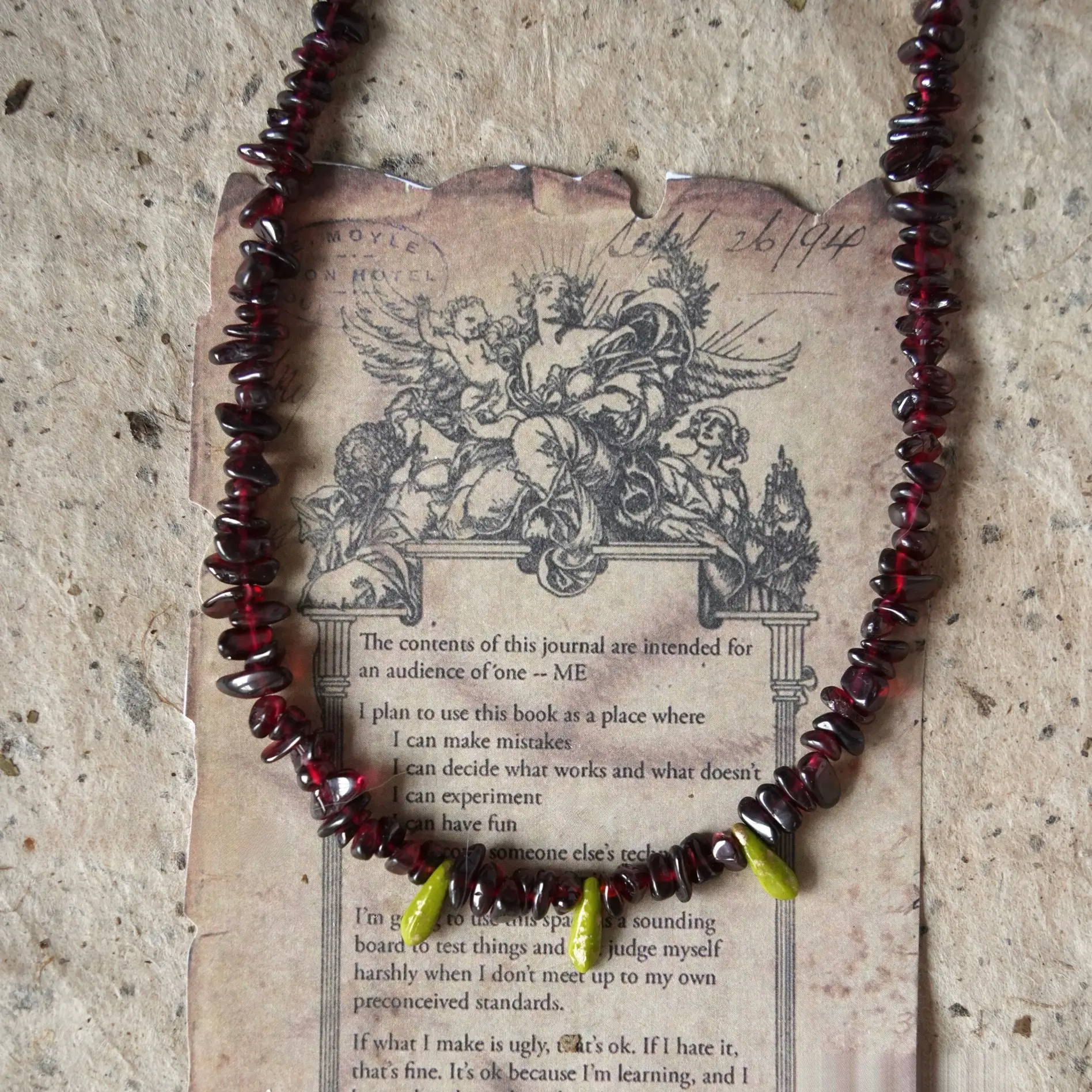 Vintage garnet beaded necklace features Czech glass accents and is handcrafted for versatile boho-style layering.