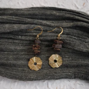 These vintage handmade earrings feature brass accents and a serene Zen-inspired design.