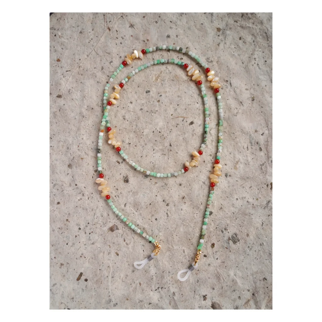 Vintage handmade long necklace with Australian jade, red agate, and nautilus shell, perfect for layering as a bracelet.
