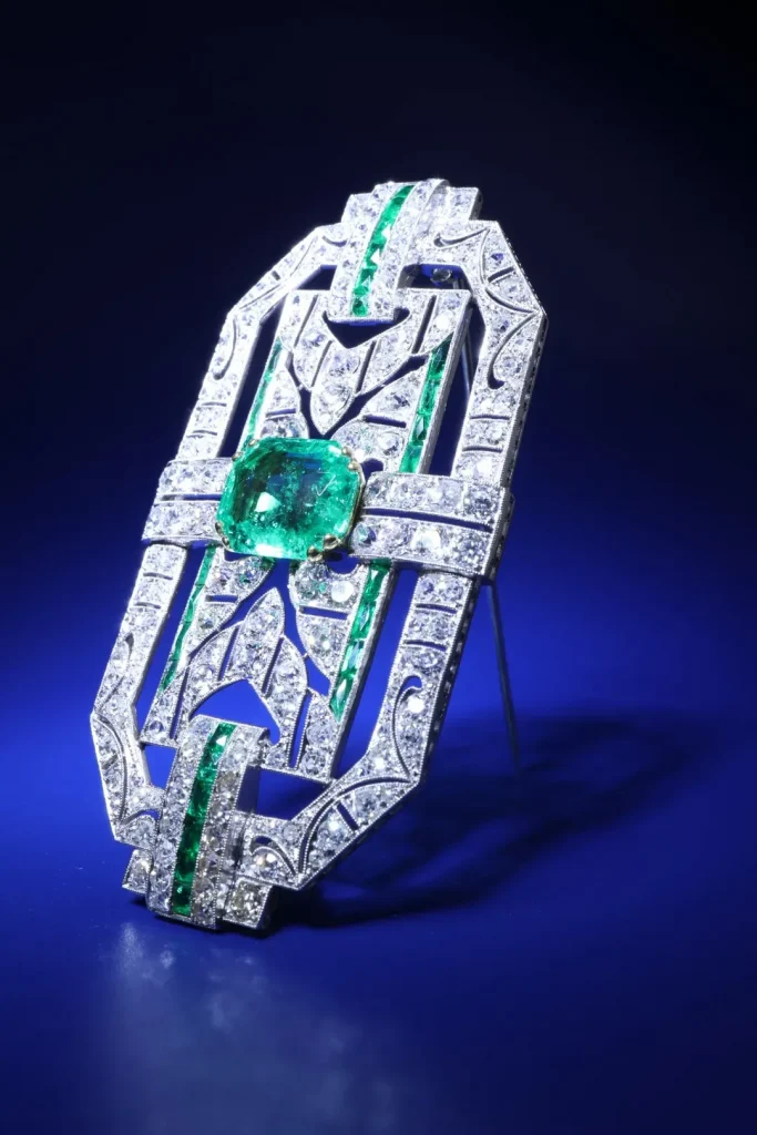 Typical Art Deco jewelry featuring geometric, mechanical designs like fan-shaped sunrays, gears, and streamlined lines, with double-band and double-clasp styles.