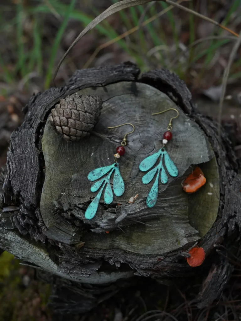 Handmade brass earrings with green patina finish and vintage-inspired texture