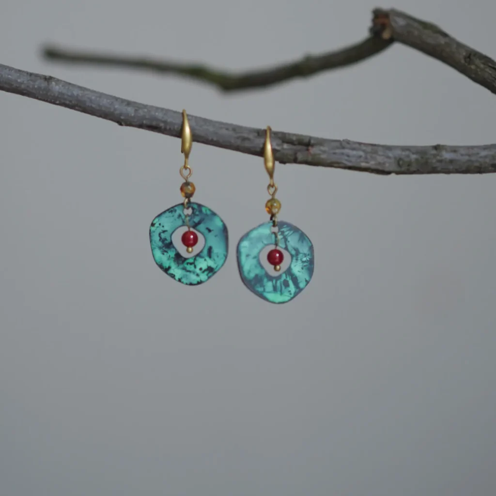 Boho brass earrings with red agate, handcrafted to reflect artistic freedom and earthy elegance.