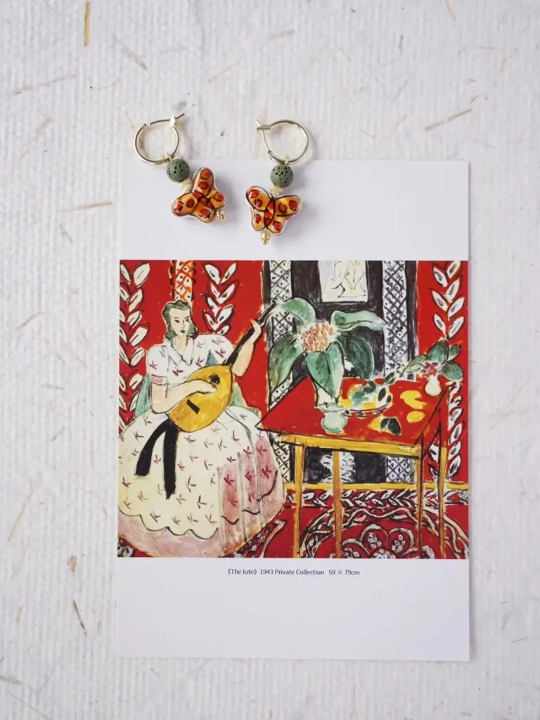 Colorful butterfly earrings with hand-painted ceramic beads and cream beads for everyday women's wear