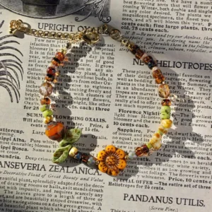 Floral beaded bracelet handcrafted with vintage Czech glass, adding botanical charm to everyday looks