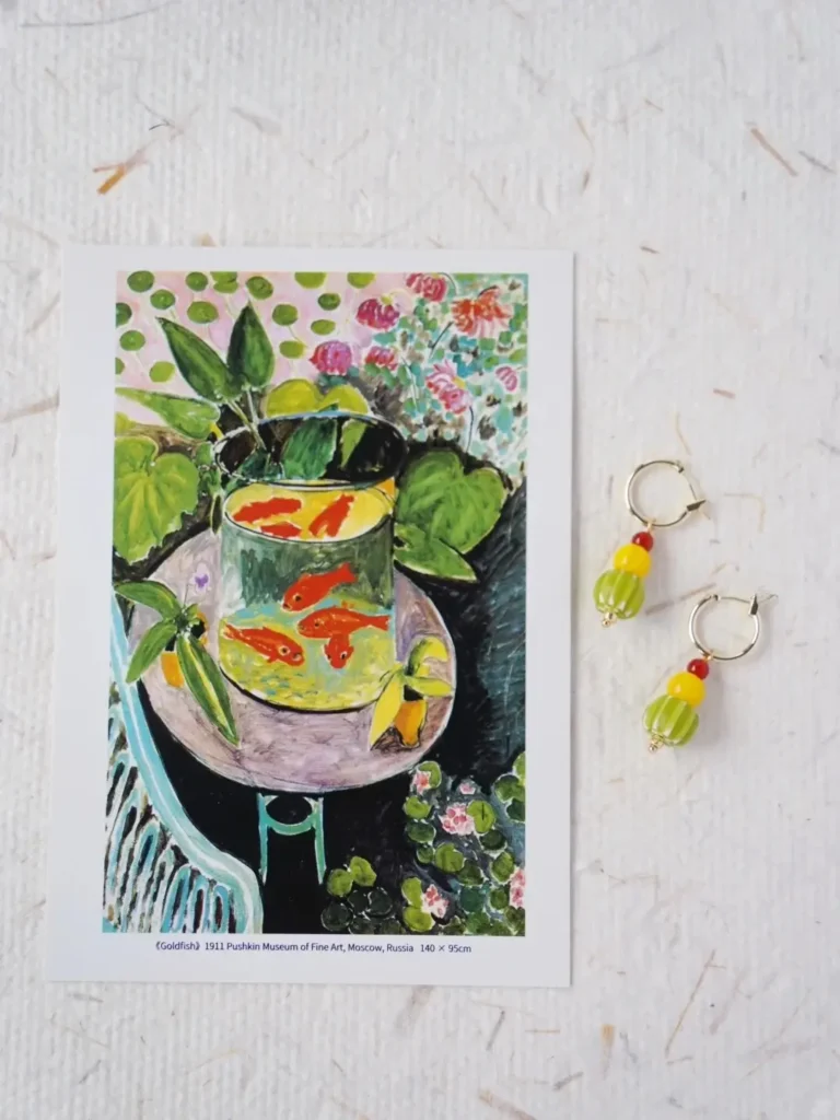 Colorful glass hoops reflect Matisse’s Goldfish inspiration, featuring artistic hues and a vintage handcrafted design.