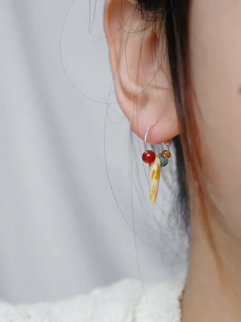 Handmade silver earrings with a unique design highlight refined charm for women.