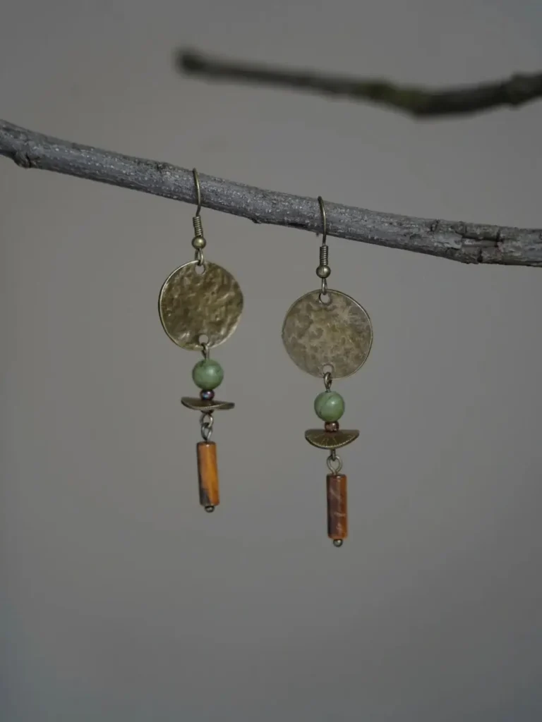 Handcrafted vintage earrings made of brass and jade with original artisan design.