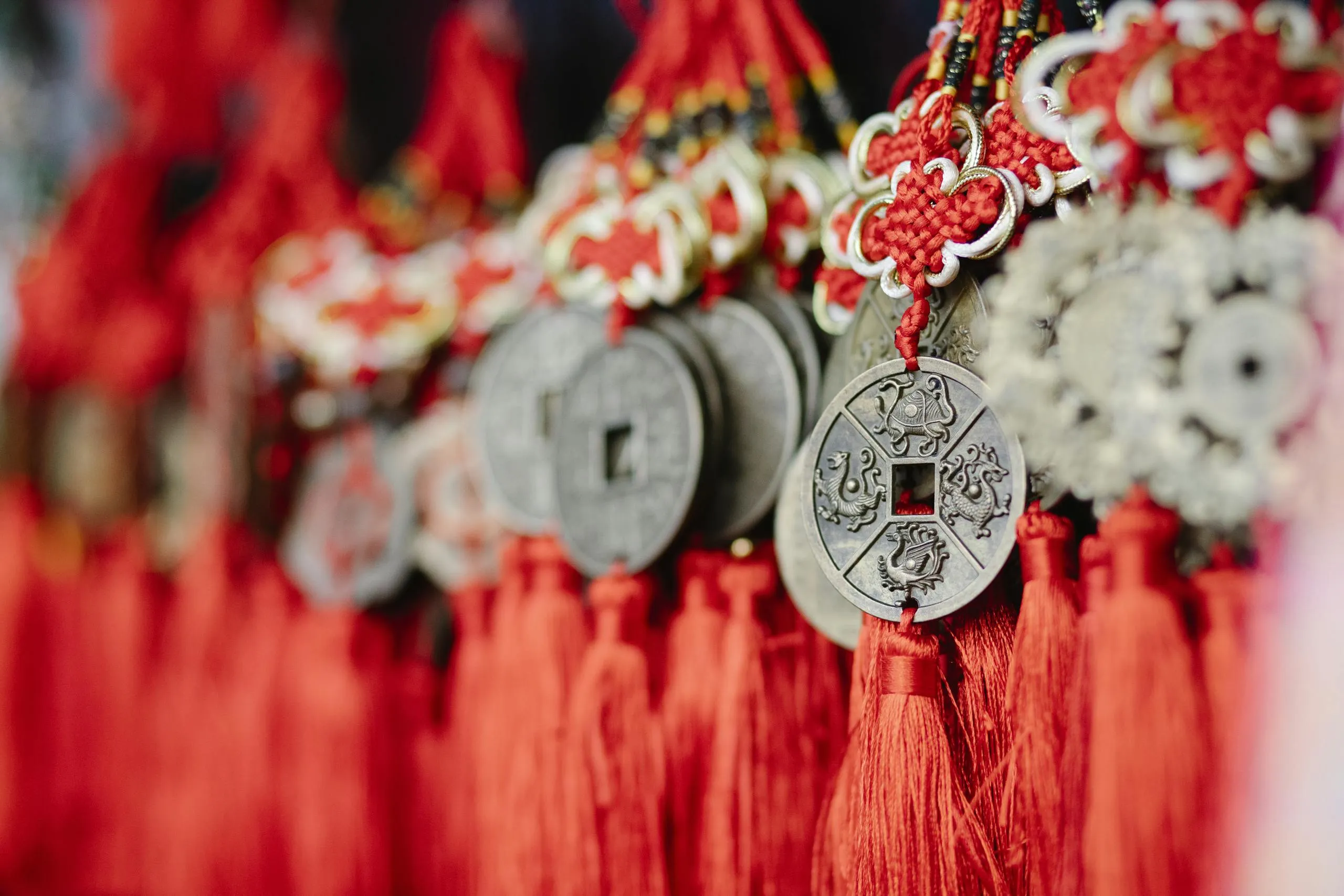 Handcrafted vintage earrings paired with a Chinese red string coin pendant, symbolizing good fortune and blessings.