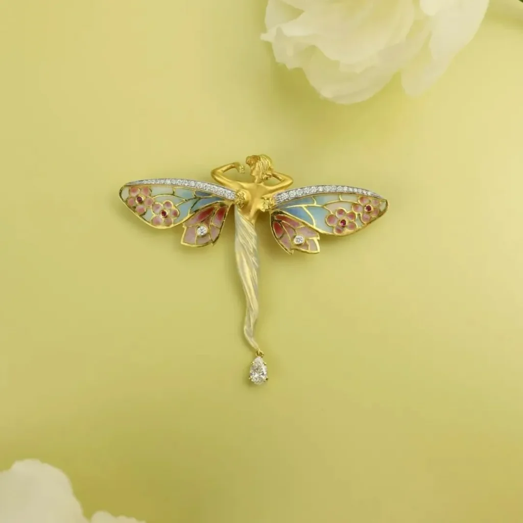 Enamel artwork of a fairy, capturing the delicate and ethereal charm of Art Nouveau craftsmanship.

Let me know if you'd like to tweak anything!