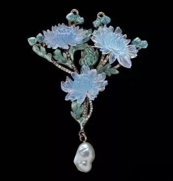 Stunning enamel jewelry showcasing the intricate and vibrant craftsmanship of the Art Nouveau period.