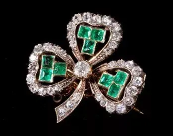 An illustration of exquisite gemstone jewelry, showcasing intricate designs and sparkling gemstones, reflecting the refined beauty of late 19th-century jewelry trends.