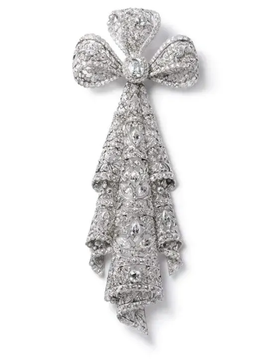 Elegant garland-style jewelry, featuring intricate floral patterns, crowns, and ribbon-like designs, inspired by 18th-century motifs.