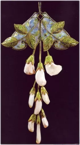 Elegant vintage earrings, featuring intricate design with colored gemstones and enamel, capturing the essence of Art Nouveau style.