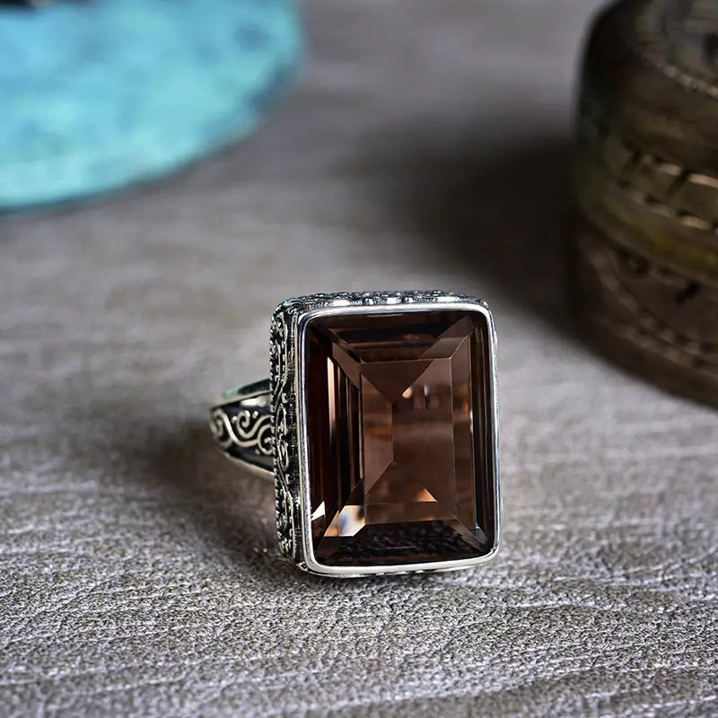 Handcrafted jewelry with a rich smoky quartz gemstone setting, showcasing a refined, contemporary style with natural beauty.