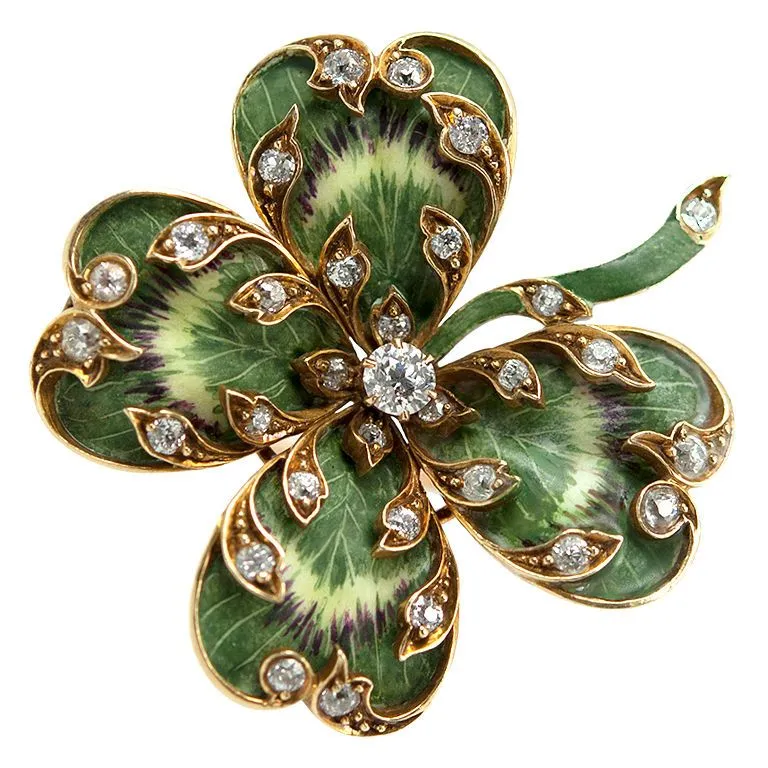 Vintage handmade gold ring featuring a four-leaf clover design with diamonds, symbolizing luck and protection.