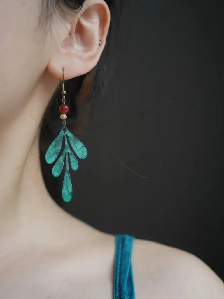 Handmade Dunhuang-style bronze earrings with vintage Bohemian design and cultural details.