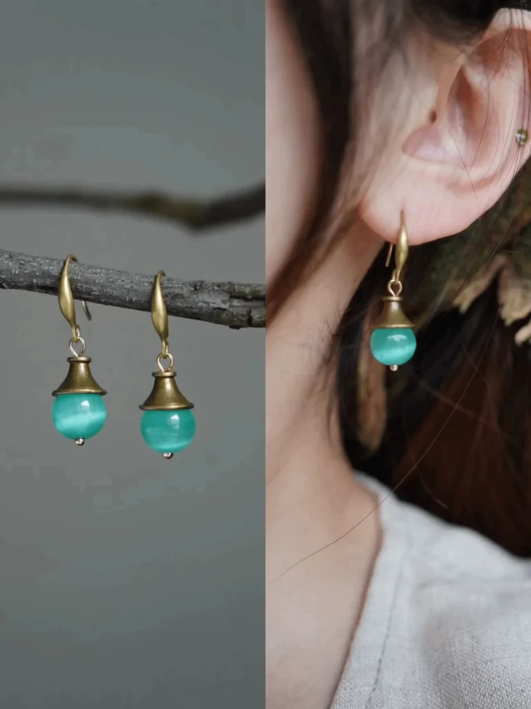 Jewea handmade blue Cat’s Eye earrings, reflecting vintage summer elegance with ocean-like depth.