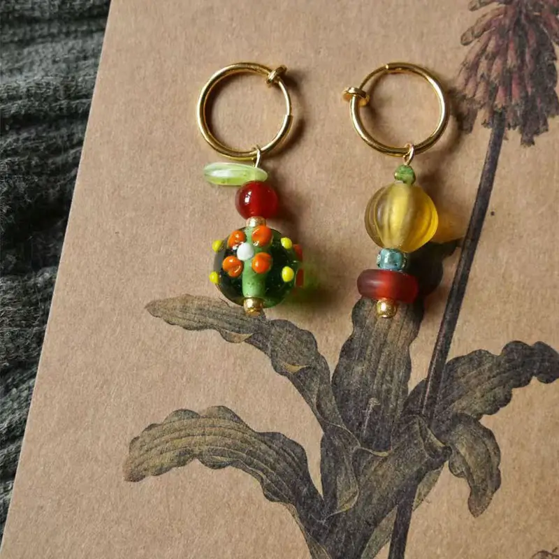 Beaded earrings made with colorful Nepalese glass beads, showcasing vintage handmade charm