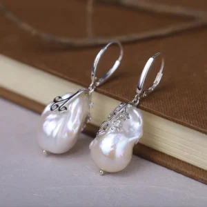 Pearl earrings paired with vintage 925 sterling silver hoops.