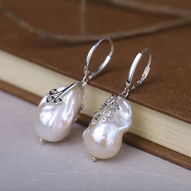 Pearl earrings paired with vintage 925 sterling silver hoops.