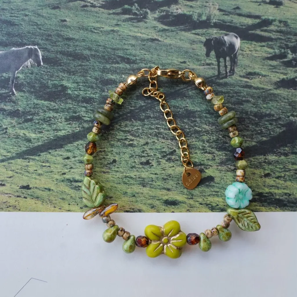 Vintage Czech glass beaded bracelet with a yellow flower charm. A nature-inspired, original design reflecting warmth and vitality.