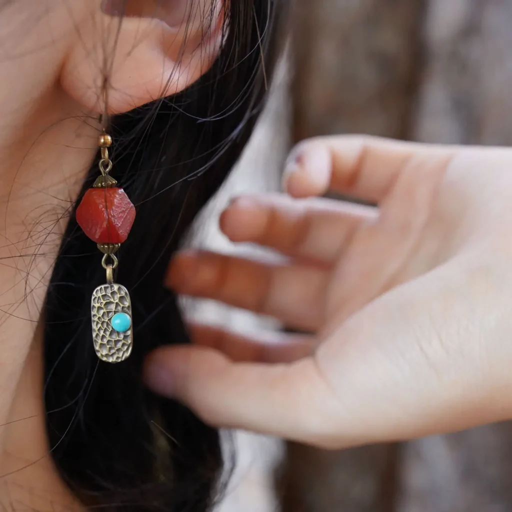 Handcrafted agate earrings worn on the ear, highlighting artisan design and elegant daily wear.
