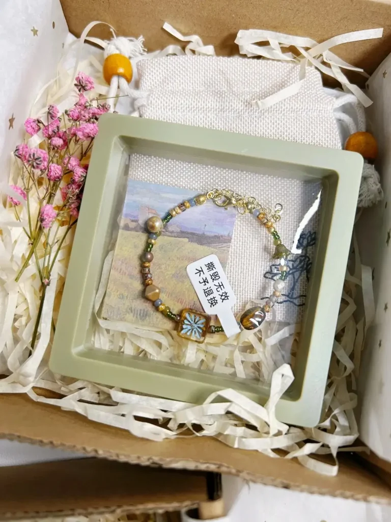 Handmade beaded bracelet in gift-ready packaging with natural tones