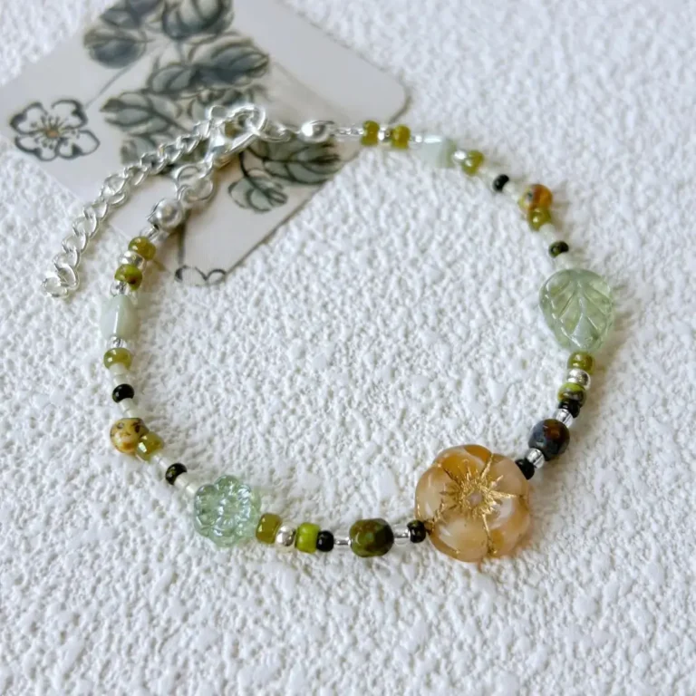 This handmade women's bracelet features green Czech beads for a fresh, minimalist women’s accessory