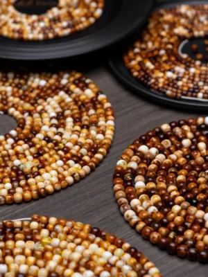 Close-up of sunstone beads on handmade vintage earrings