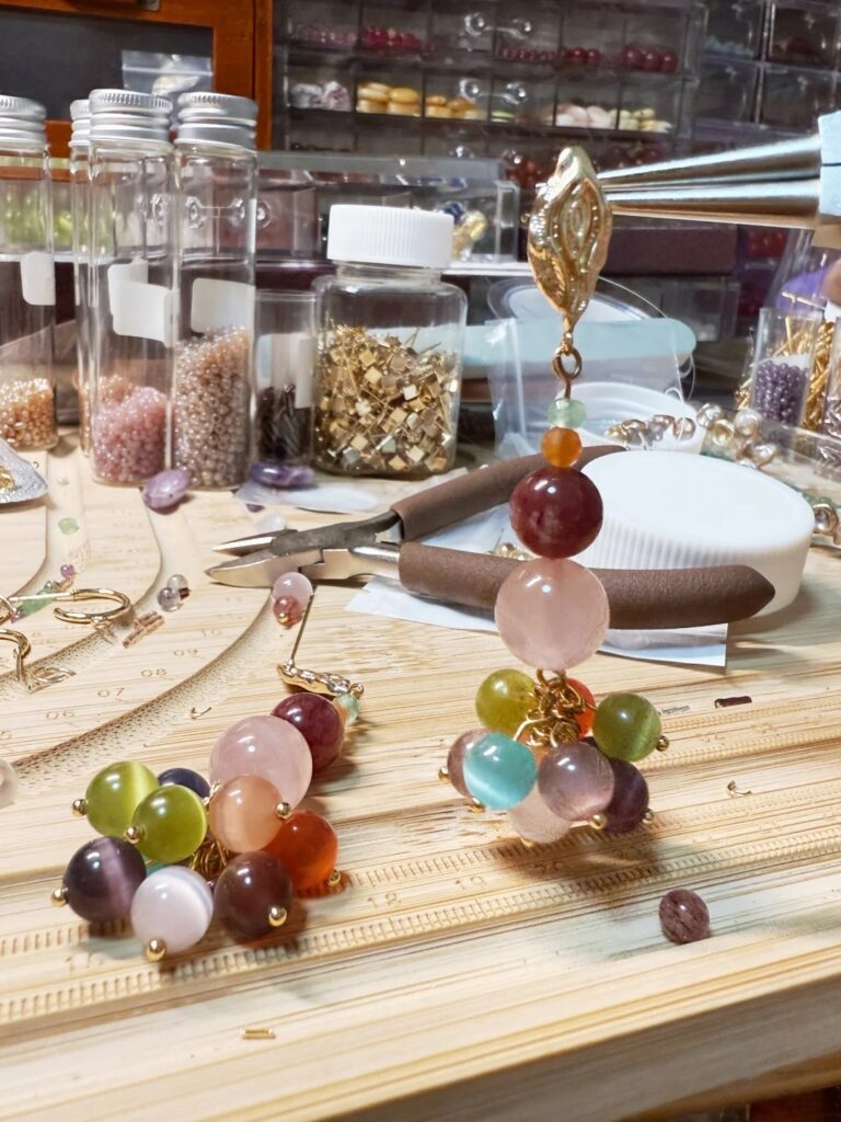 Jewea designer sketching and crafting handmade jewelry in the studio