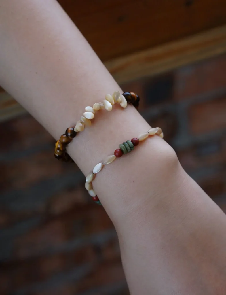 Layered handmade beaded bracelets showcased from different angles, highlighting their textures, colors, and artisanal details.