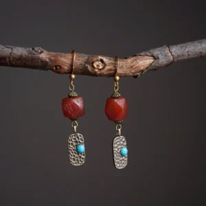 Vintage faceted agate earrings paired with hammered brass for stylish Tibetan-inspired daily wear.