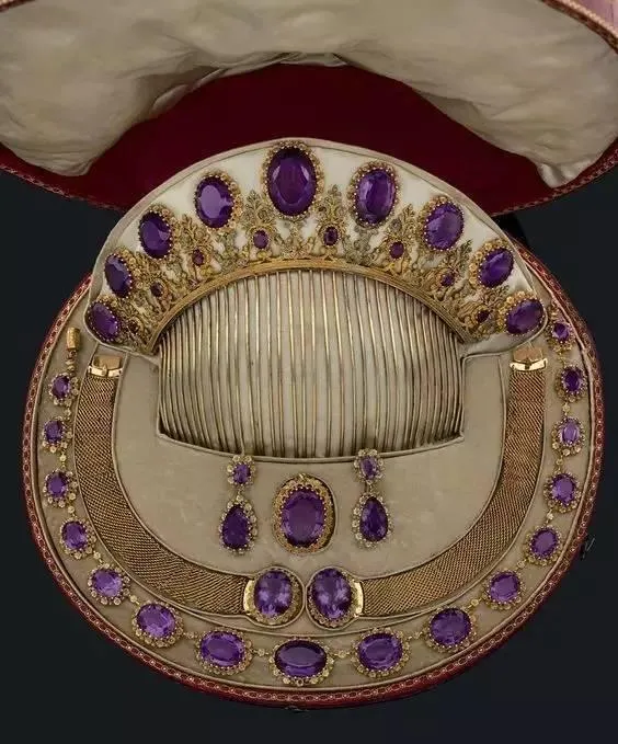 A violet amethyst jewelry set featuring deep purple gemstones with trace iron-induced coloring.