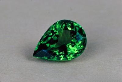 Andradite garnet gemstone showing green color and crystal structure
