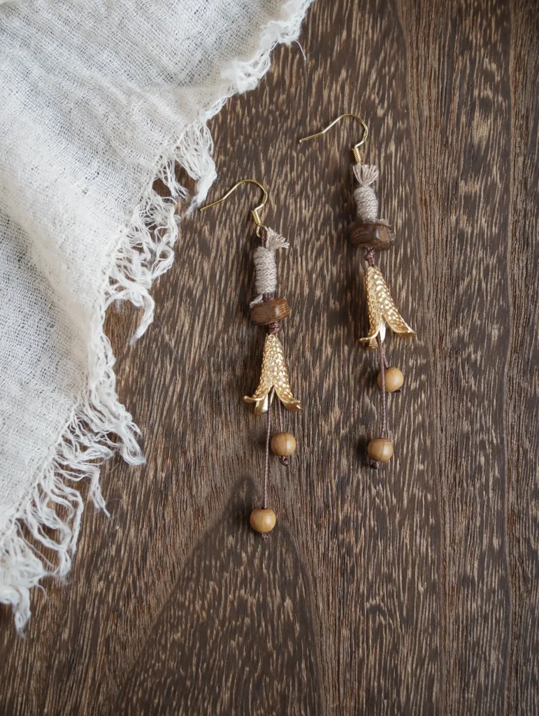 Antique bronze clip-on earrings featuring 14K gold-plated copper charms for elegant autumn style.