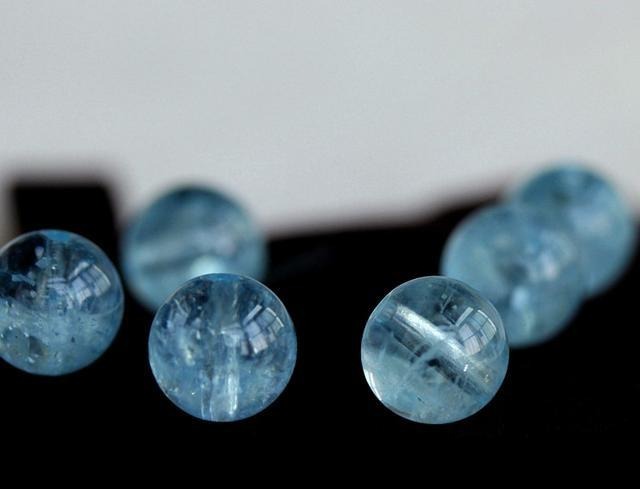 Assorted gemstone beads in various colors and shapes for jewelry making