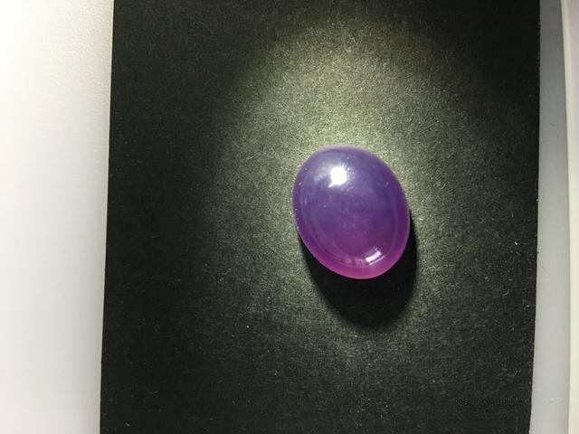 Baoshan ice purple cabochon specimen with deep, rich, and intense purple color